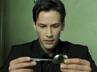 Keanu Reeves as Neo in Matrix attempting to bend a spoon 