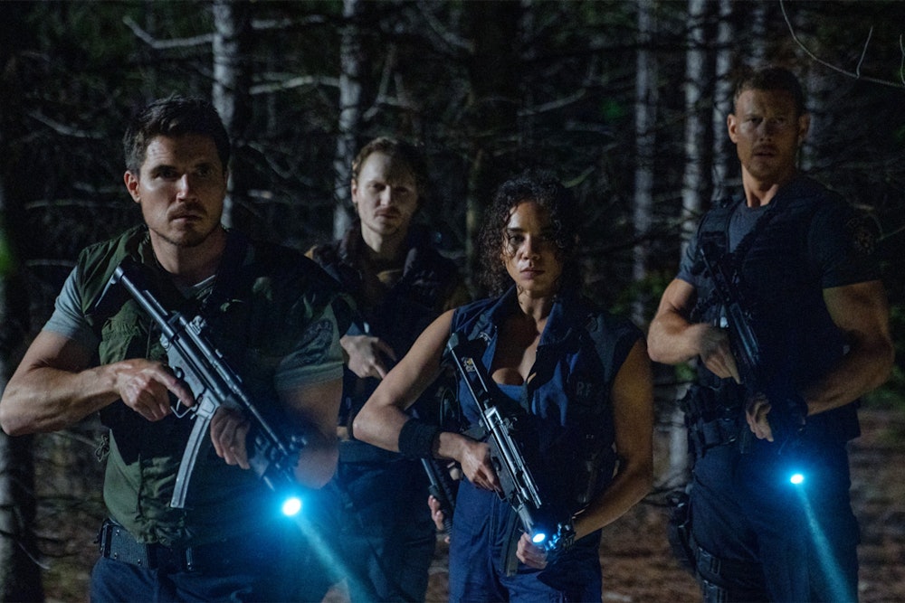 Robbie Amell, Chad Rook, Hannah John-Kamen, and Tom Hopper in Resident Evil: Welcome to Raccoon City...