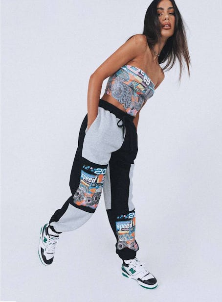 Model wearing Princess Polly's graphic sweatpants.