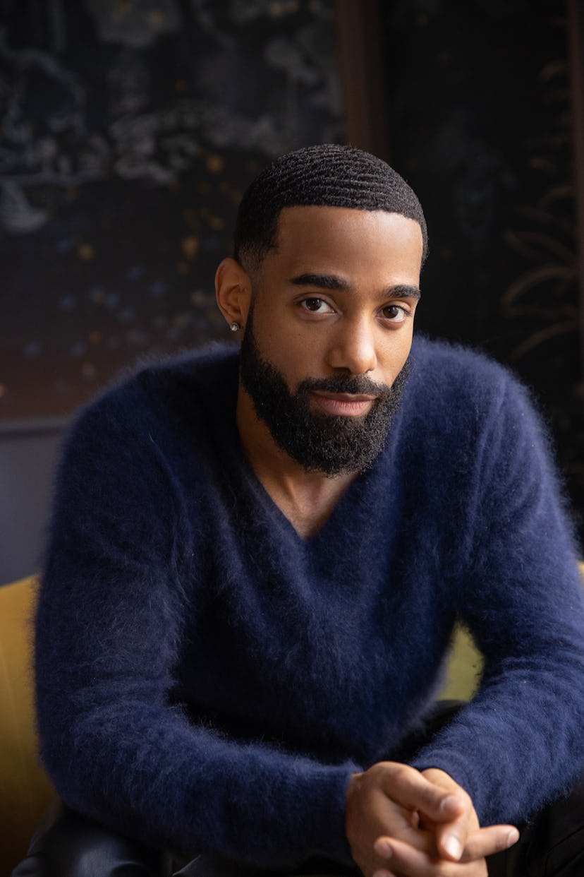 Philemon Chambers wearing a blue sweater
