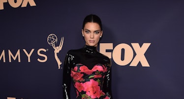 Kendall Jenner attends the 71st Emmy Awards in a floral gown with a latex black turtleneck underneat...
