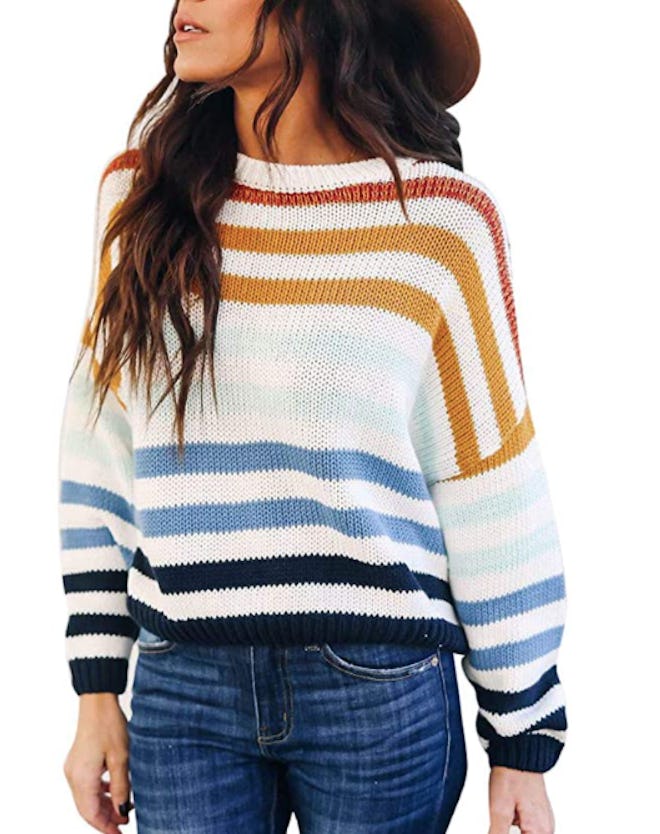 This comfy crew-neck sweater features cheerful rainbow stripes.