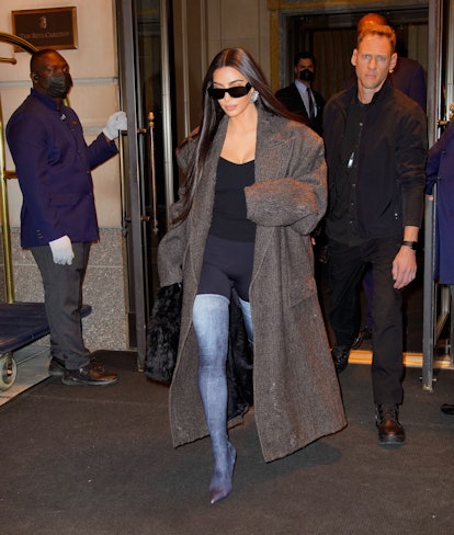 Kim Kardashian wears denim print Balenciaga boots in New York City. 