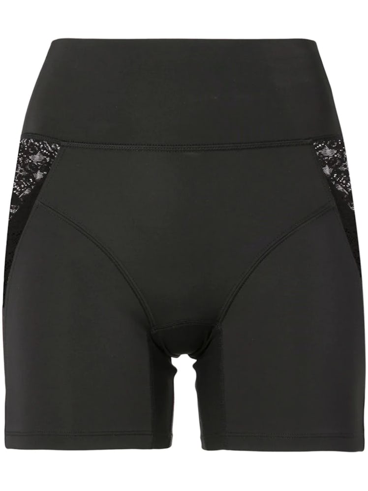 Black lace-trimmed biker shorts from Kiki de Montparnasse, available to shop on Farfetch.