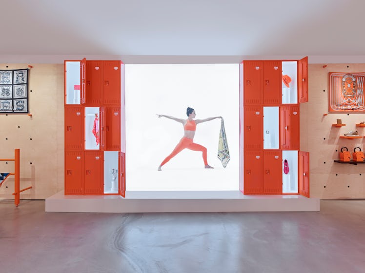 a model poses in the new HermesFit pop-up shop