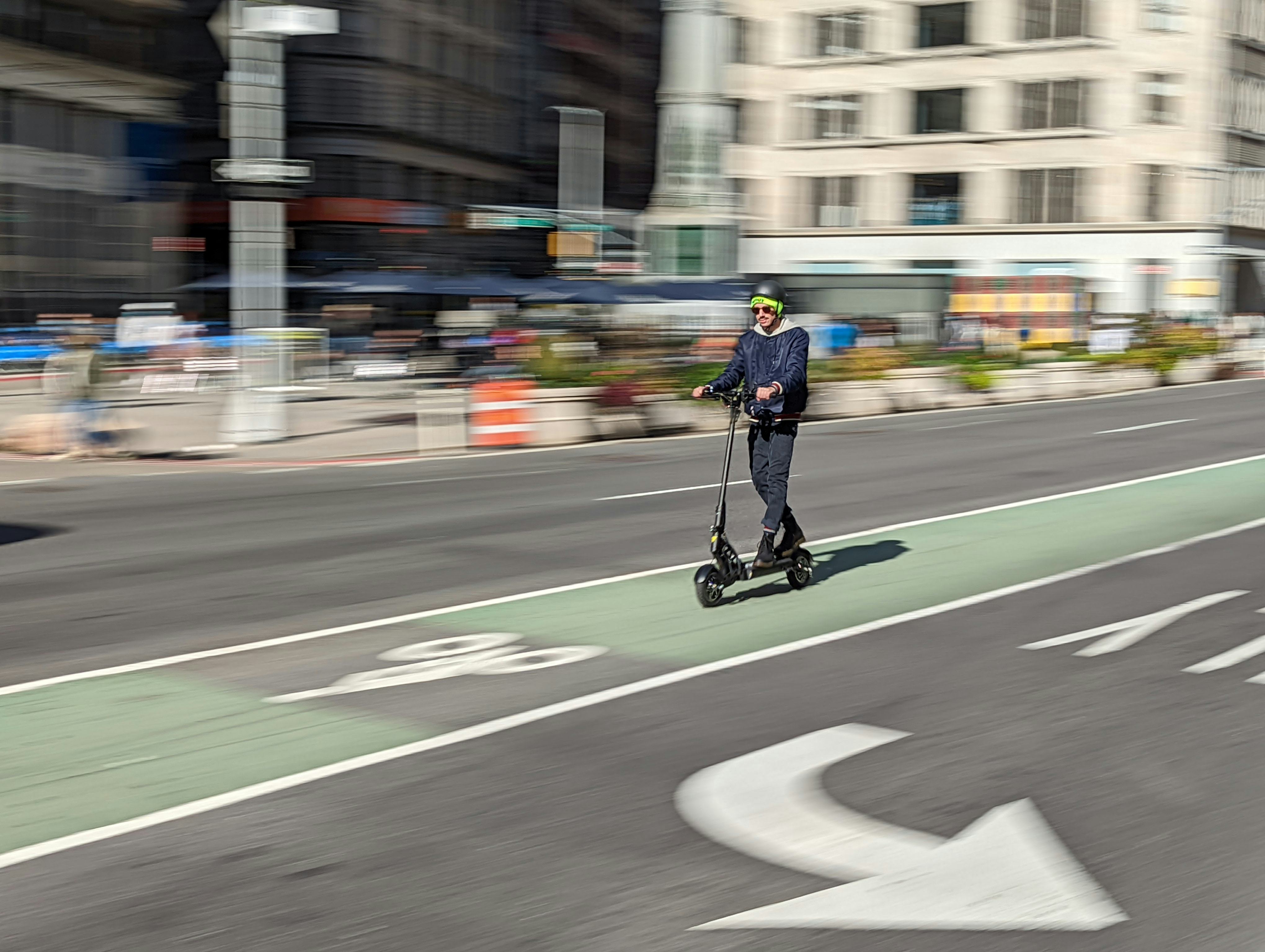 A man riding Apollo Ghost electric scooter. EV. Electric vehicles. EVs. e-scooter