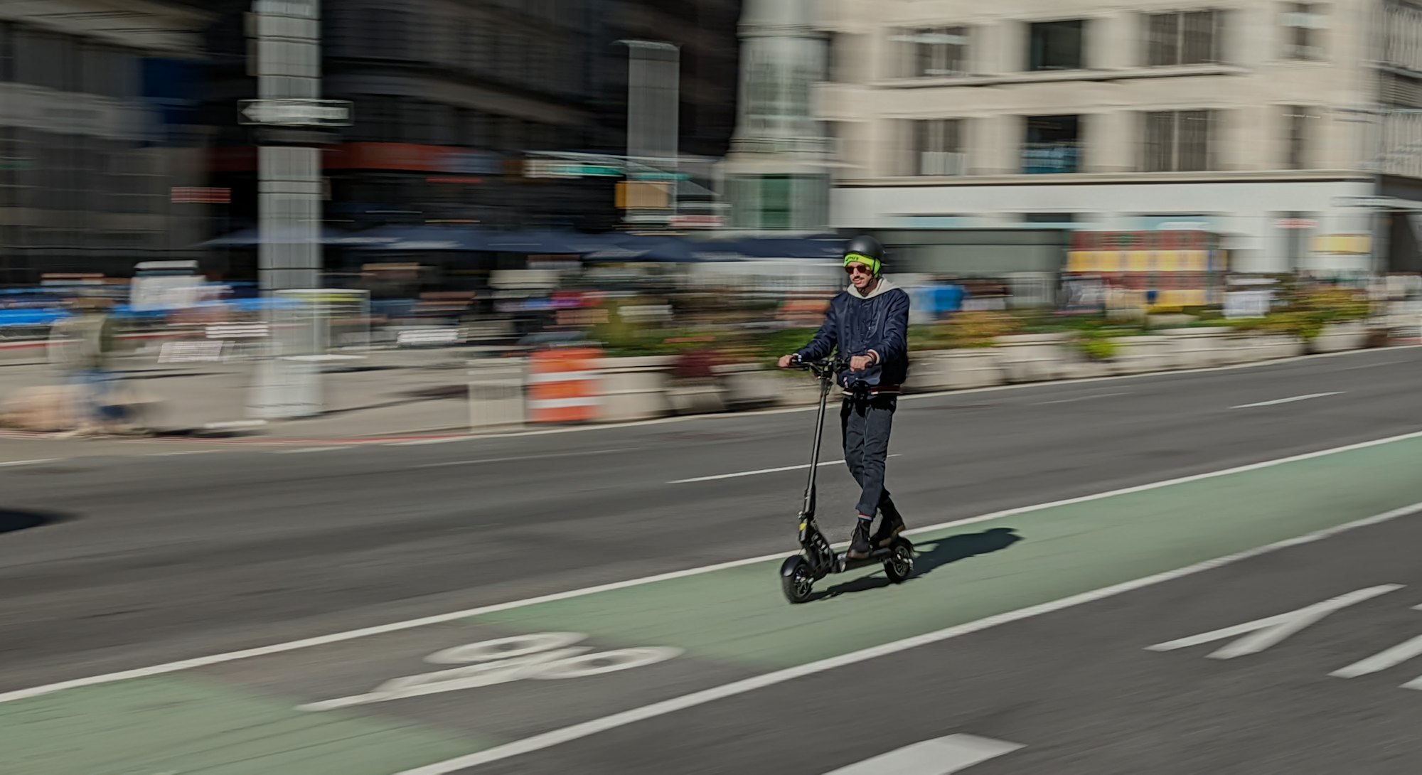 A man riding Apollo Ghost electric scooter. EV. Electric vehicles. EVs. e-scooter
