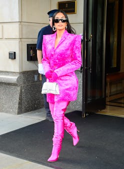 Kim Kardashian wearing pink boots and a matching coat on October 7, 2021 in New York City. 