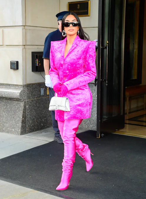 Kim Kardashian wearing pink boots and a matching coat on October 7, 2021 in New York City.