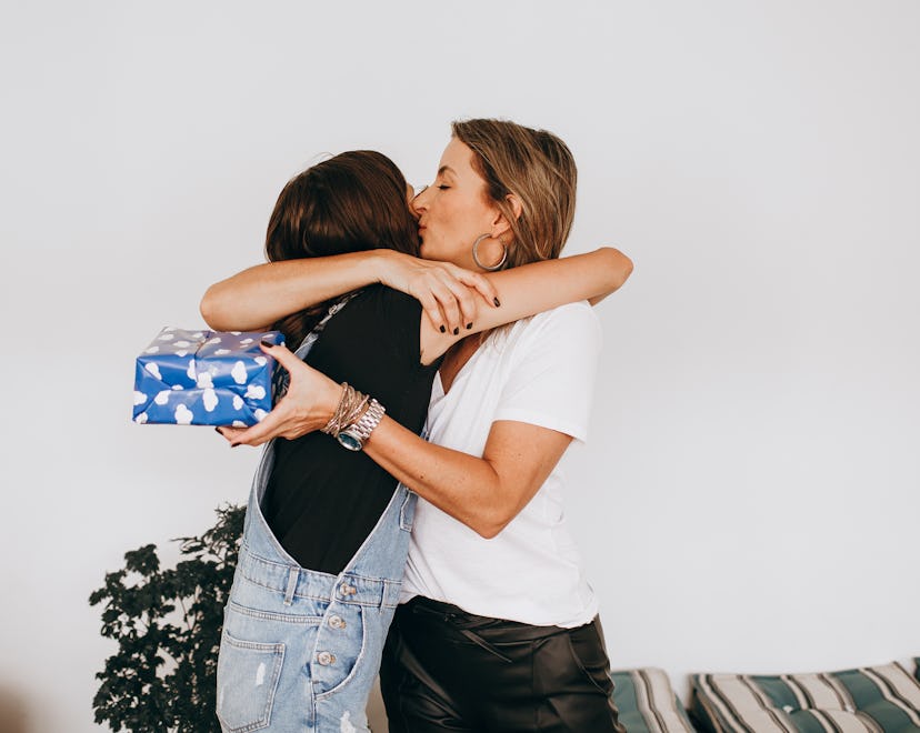 mom and daughter hugging after receiving a last minute birthday gift