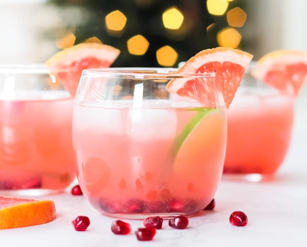 Three stemless wineglasses filled with grapefruit punch 