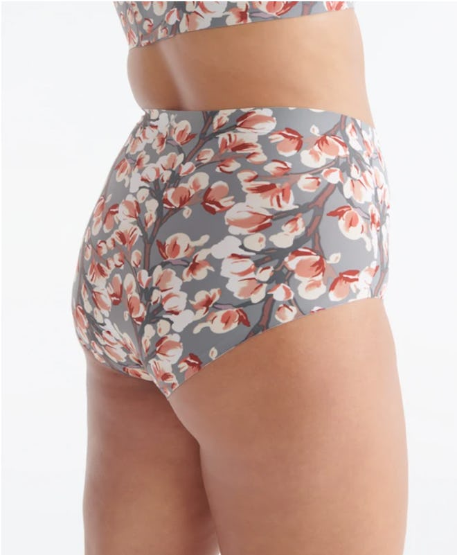 Image of a woman wearing Knix floral-print high-rise underwear.