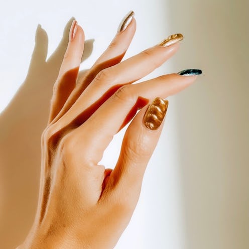 Magnetic nail polish is a great way to get cat eye velvet nails at home.
