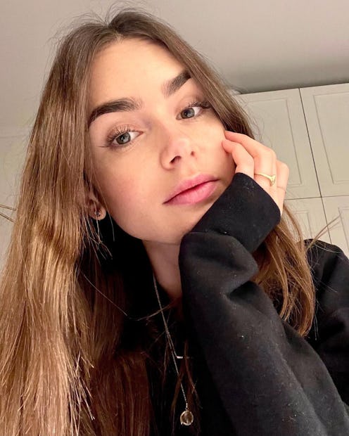 Lily Collins selfie with hand on face