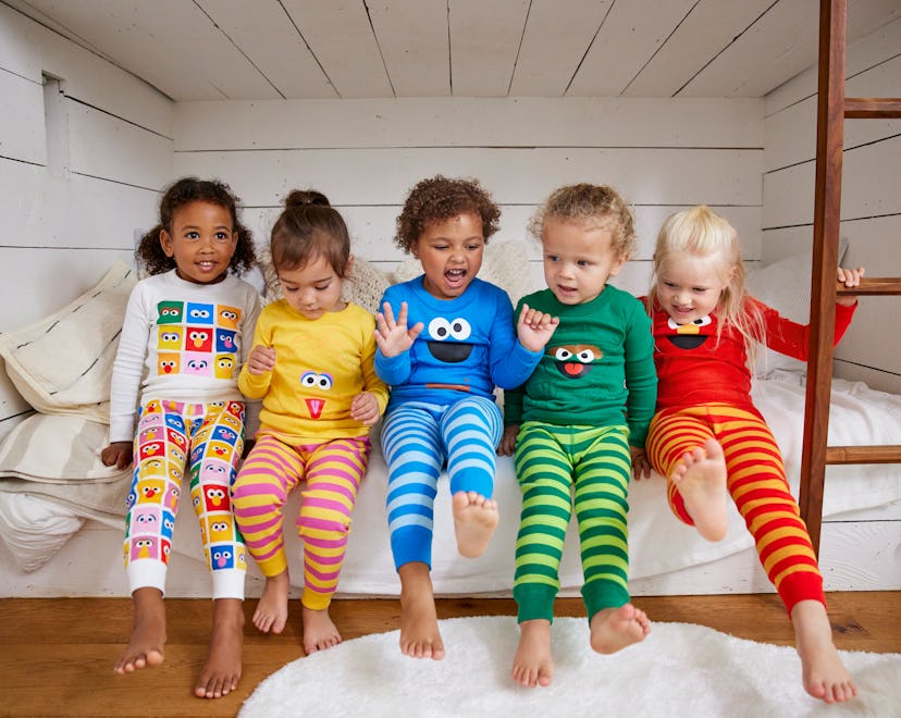 kids wearing the new sesame street x hanna andersson pajamas