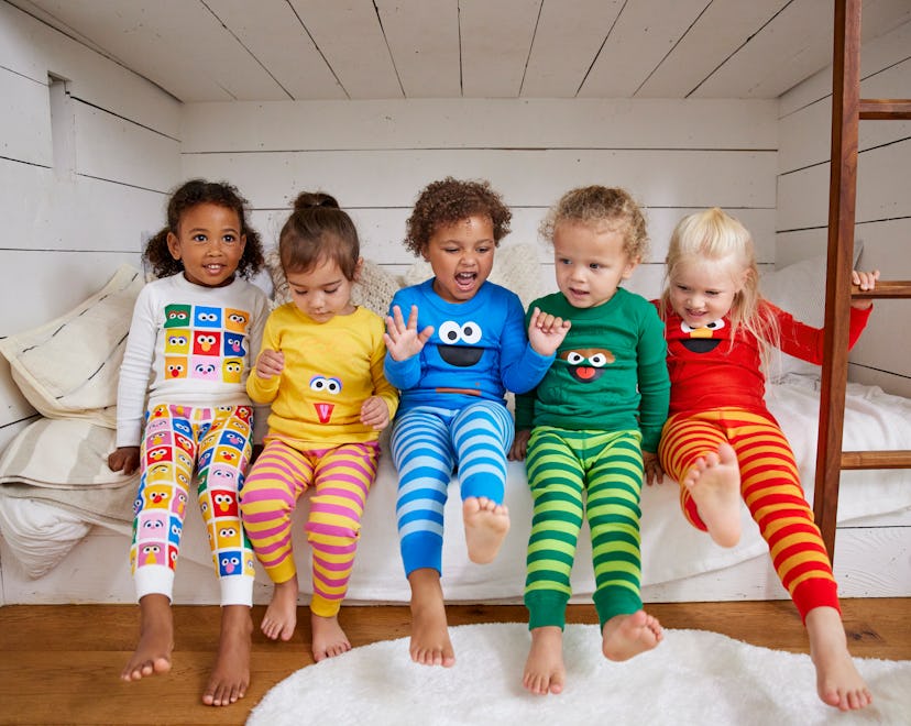 kids wearing the new sesame street x hanna andersson pajamas