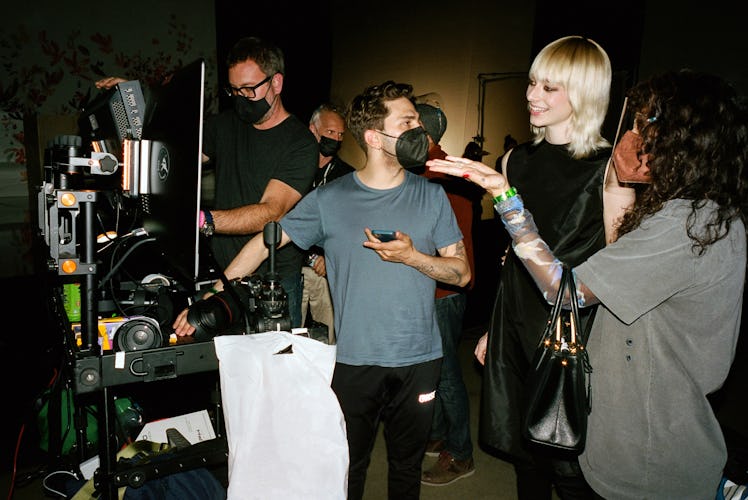 Xavier Dolan with Hunter Schafer on set of Prada Galleria bag campaign video