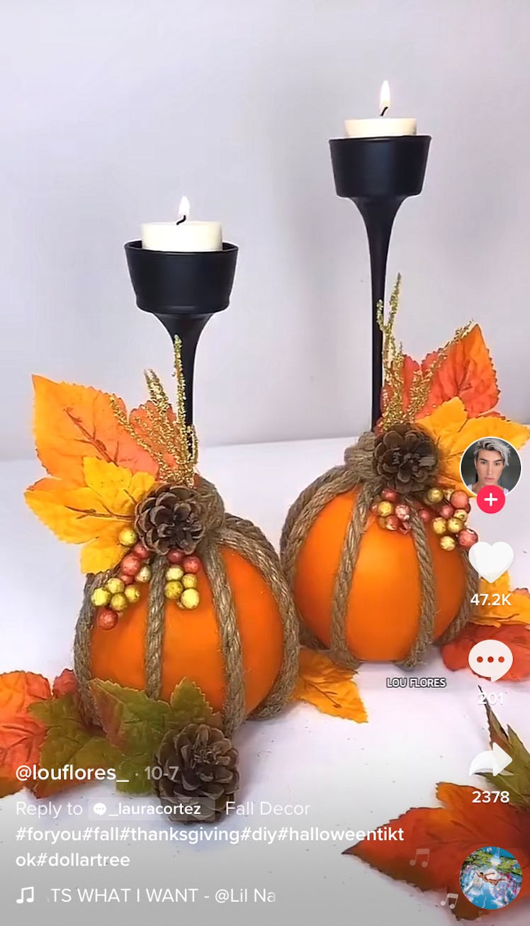 These pumpkin fall candle holders are just some of the TikTok Thanksgiving decor ideas you can do. 