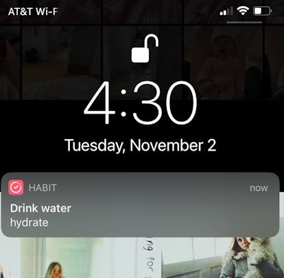 A screenshot of a Habit Tracker notification reminding the user to hydrate.