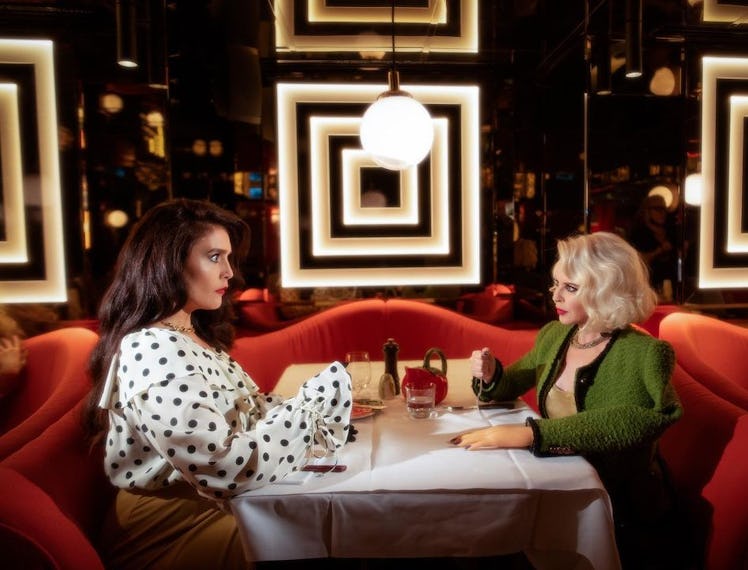 Jessie Ware and Kylie Minogue at a table. 