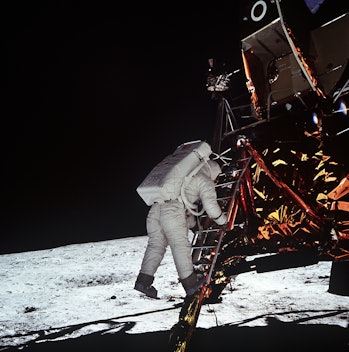 Buzz Aldrin dangling above the lunar surface
