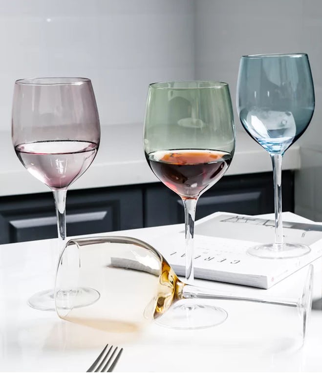 Image of four wine glasses in soft pink, blue, green and yellow colors.