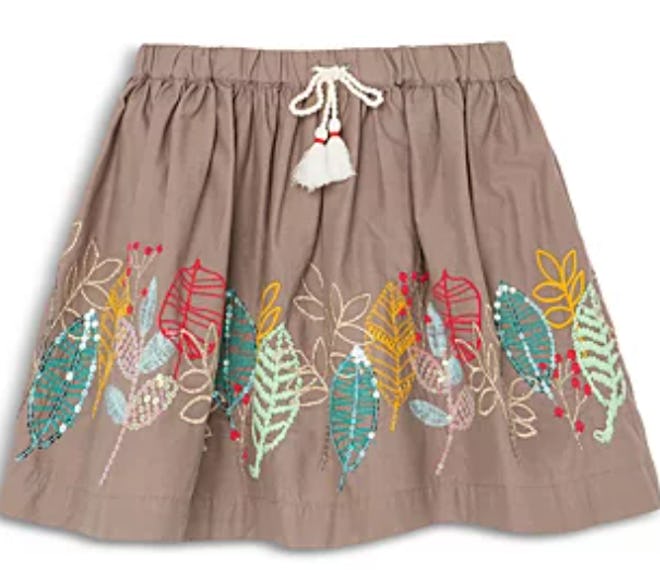 Image of a kid's taupe-colored skirt with multicolor leaf print.