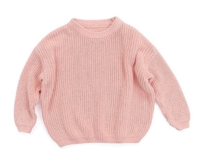 Image of a pink cropped kid's knit long-sleeve sweater. 