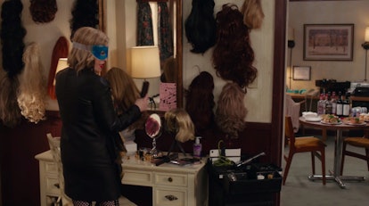 Create your own wall of wigs for your Friendsgiving party like Moira Rose from 