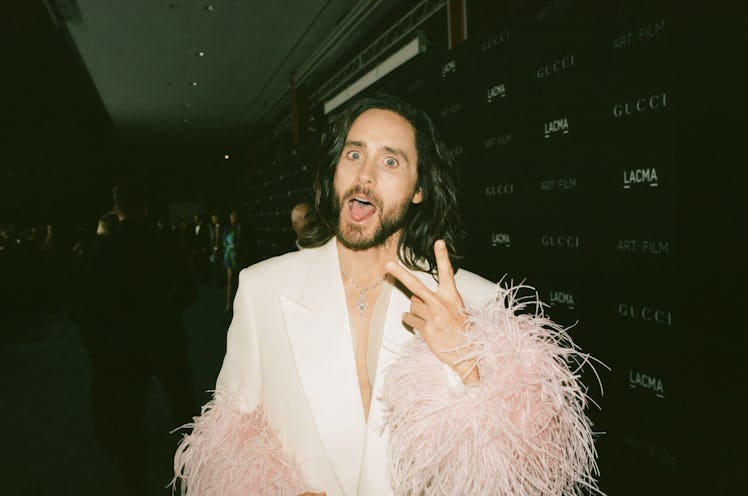 Jared Leto in pink feather suit.