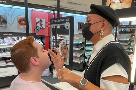 Makeup being applied by a makeup artist.