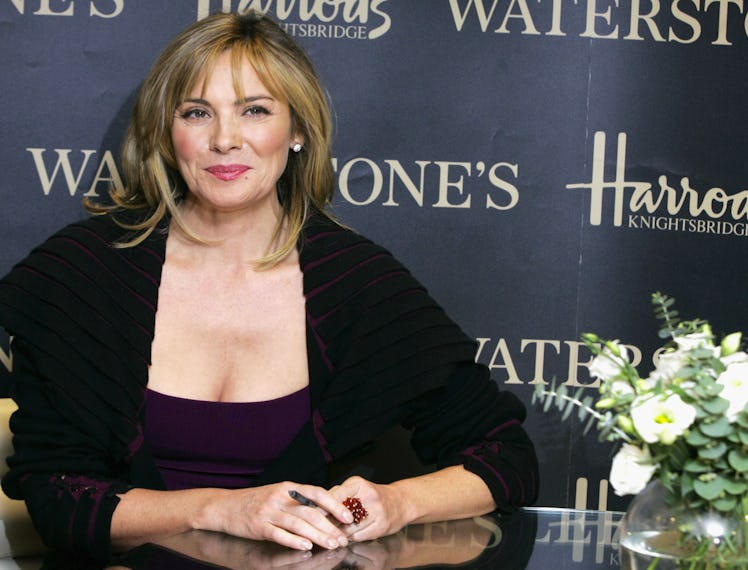 Kim Cattrall, sitting.