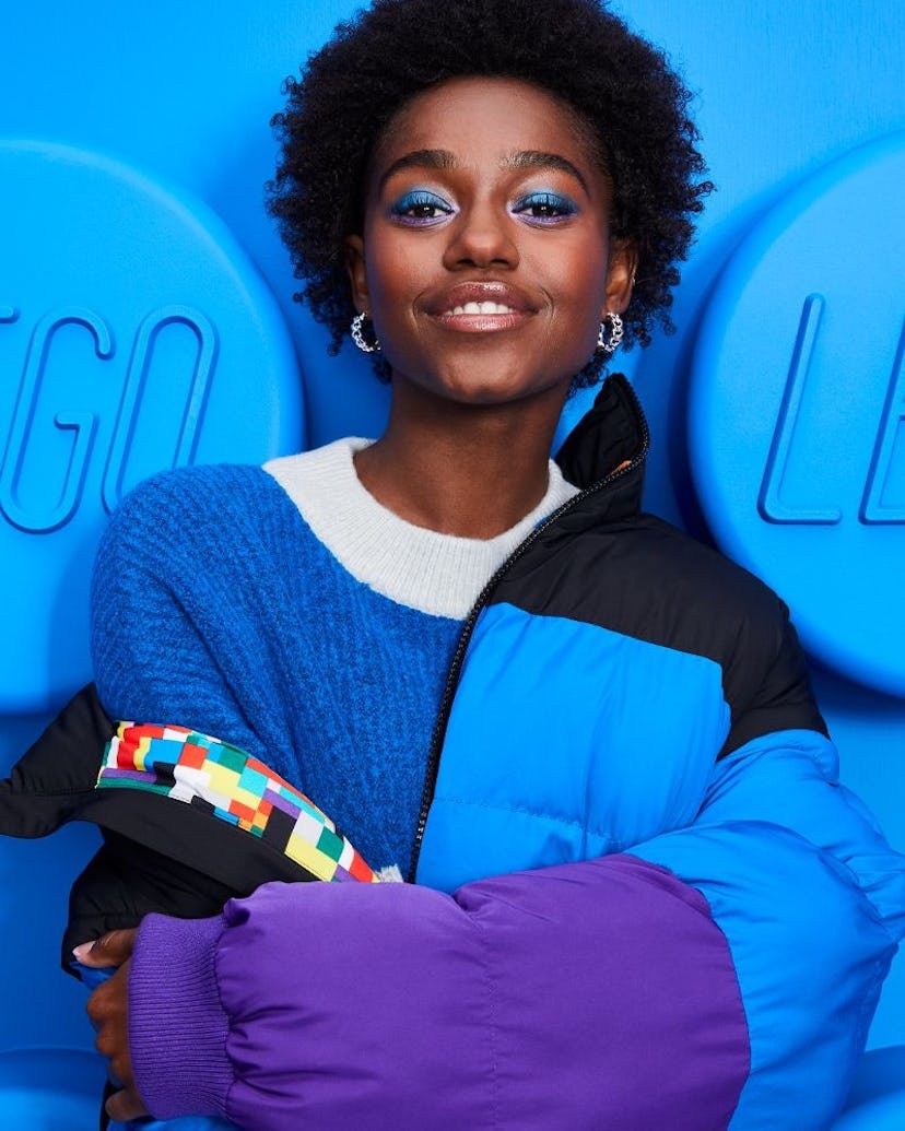 woman dressed in blue and purple jacket from lego for target collection