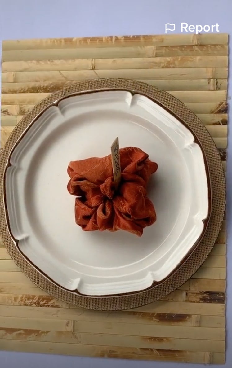 These pumpkin napkins are an easy Thanksgiving decor hack from TikTok.