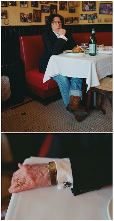 Fran Lebowitz having dinner in a uniform suit jacket and denim pants with leather cowboy boots.