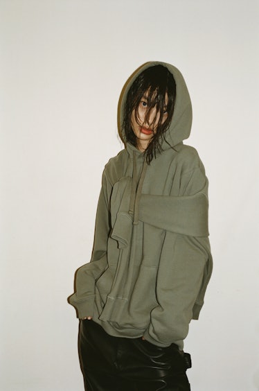 A model in a green hoodie by Altu 