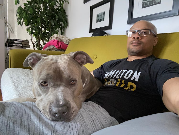 Coach Isaac Brown and his pitbull Xena