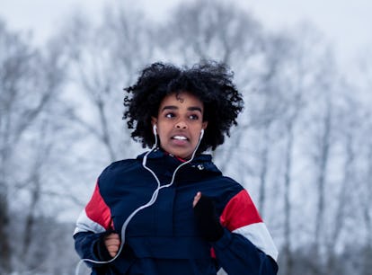 Young woman running through snow the week of December 20, 2021, which will be the worst for her unlu...