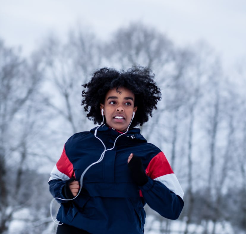Young woman running through snow the week of December 20, 2021, which will be the worst for her unlu...