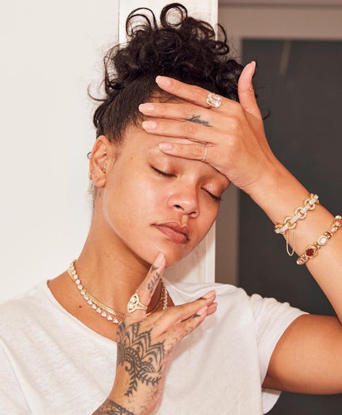 Rihanna with glowing skin and no makeup on.