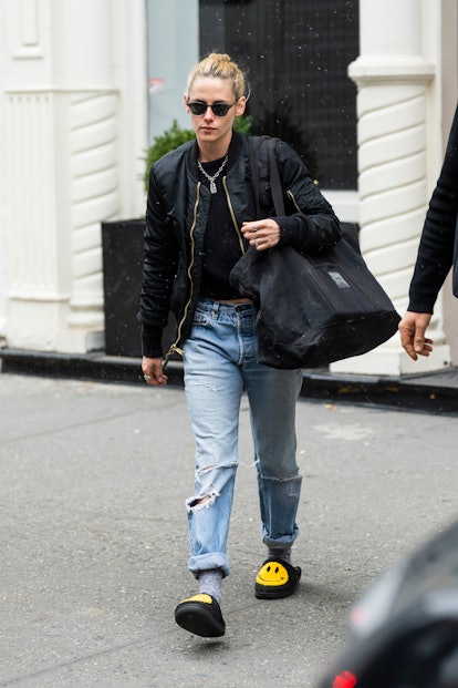 Kristen Stewart is seen wearing smiley face slippers on November 30, 2021 in New York City.  