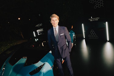 Lamborghini Chairman and CEO Stephan Winkelmann posing in front of a car