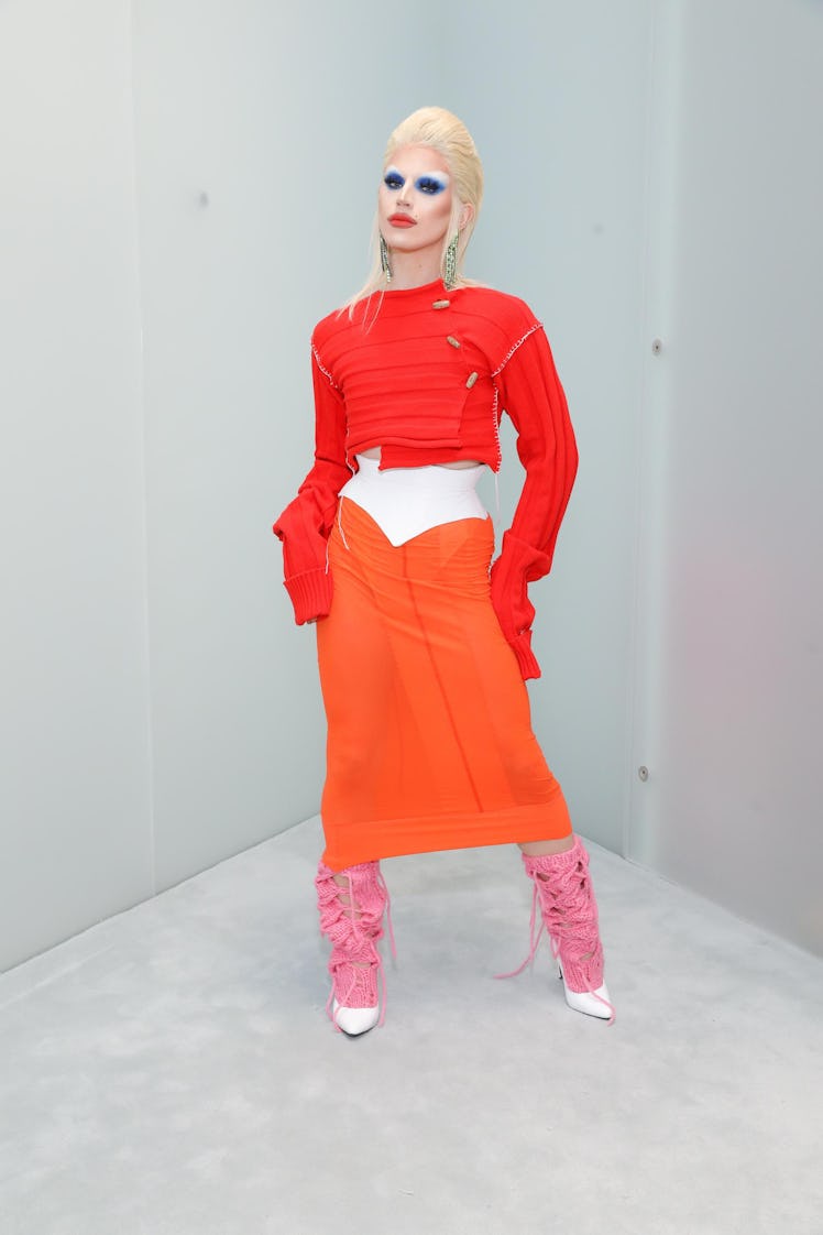 Aquaria in an orange dress at the reopening of Acne Studios’ SoHo store