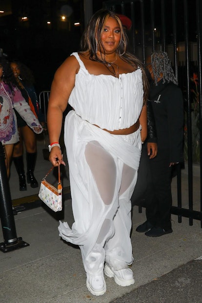 Lizzo's all-white corset and trouser outfit for Kanye West's concert. 