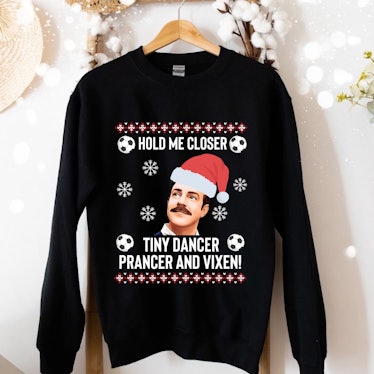 This 'Ted Lasso' ugly Christmas sweater has Ted Lasso on the front. 
