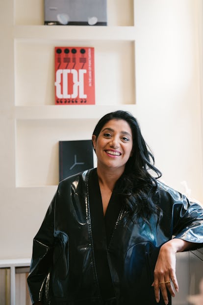 the architect Suchi Reddi smiling and wearing a black leather jacket and black blouse