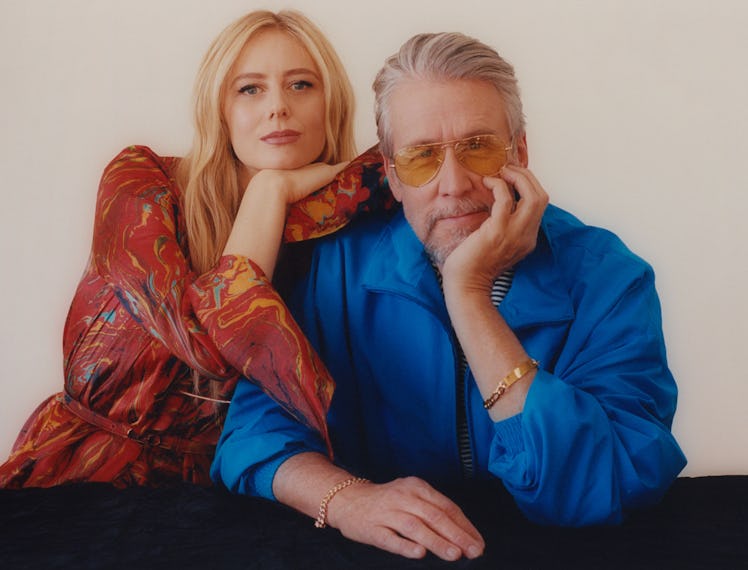 Alan Ruck leaning on a table as Justine Lupe leans on him