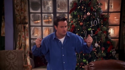 Chandler stands in front of a Christmas tree in his apartment in  "The One with the Routine."