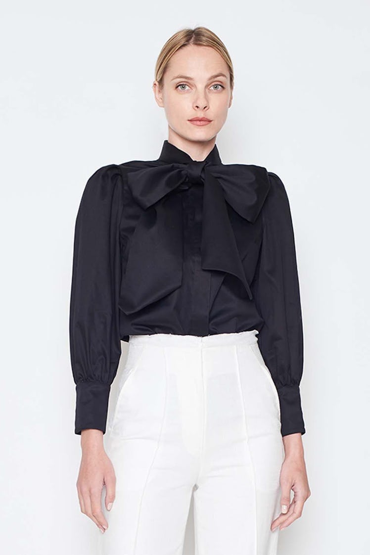 ARIAS black bow neck blouse.