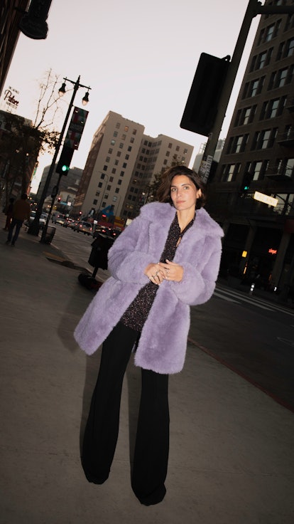 Model wears Mango's oversized faux fur coat.